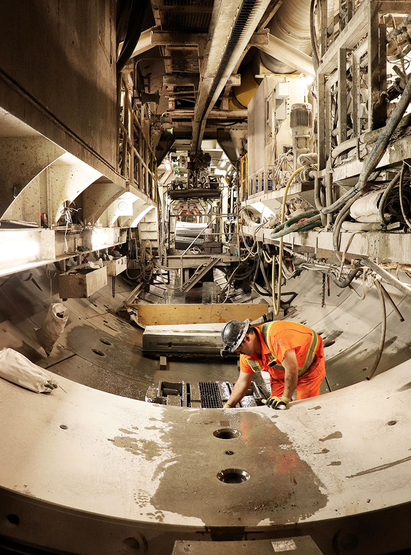 Worker working inside the Alice tunnel boring machine